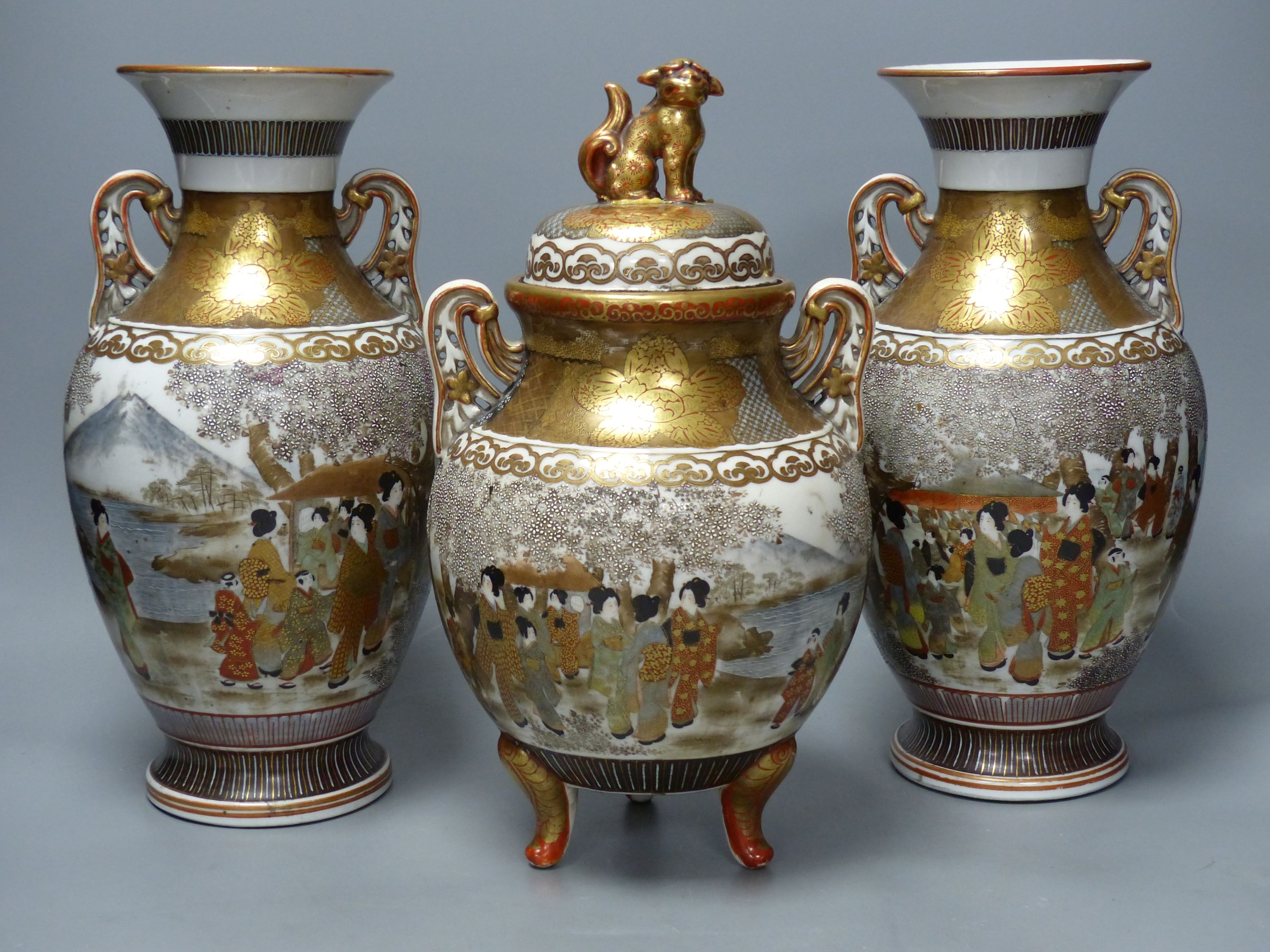 A Japanese Kutani porcelain garniture of two vases and a similar koro and cover, tallest 31cm